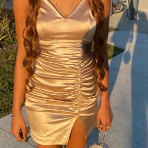 Champagne/ cream open chest dress with a open leg